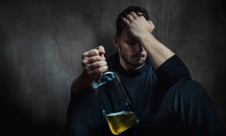 man with bottle of alcohol